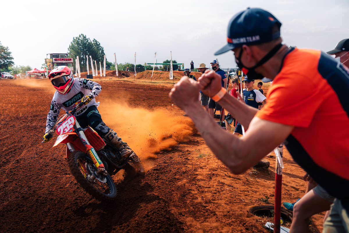 The Red Bull KTM team cheer for Jonathan Mlimi.